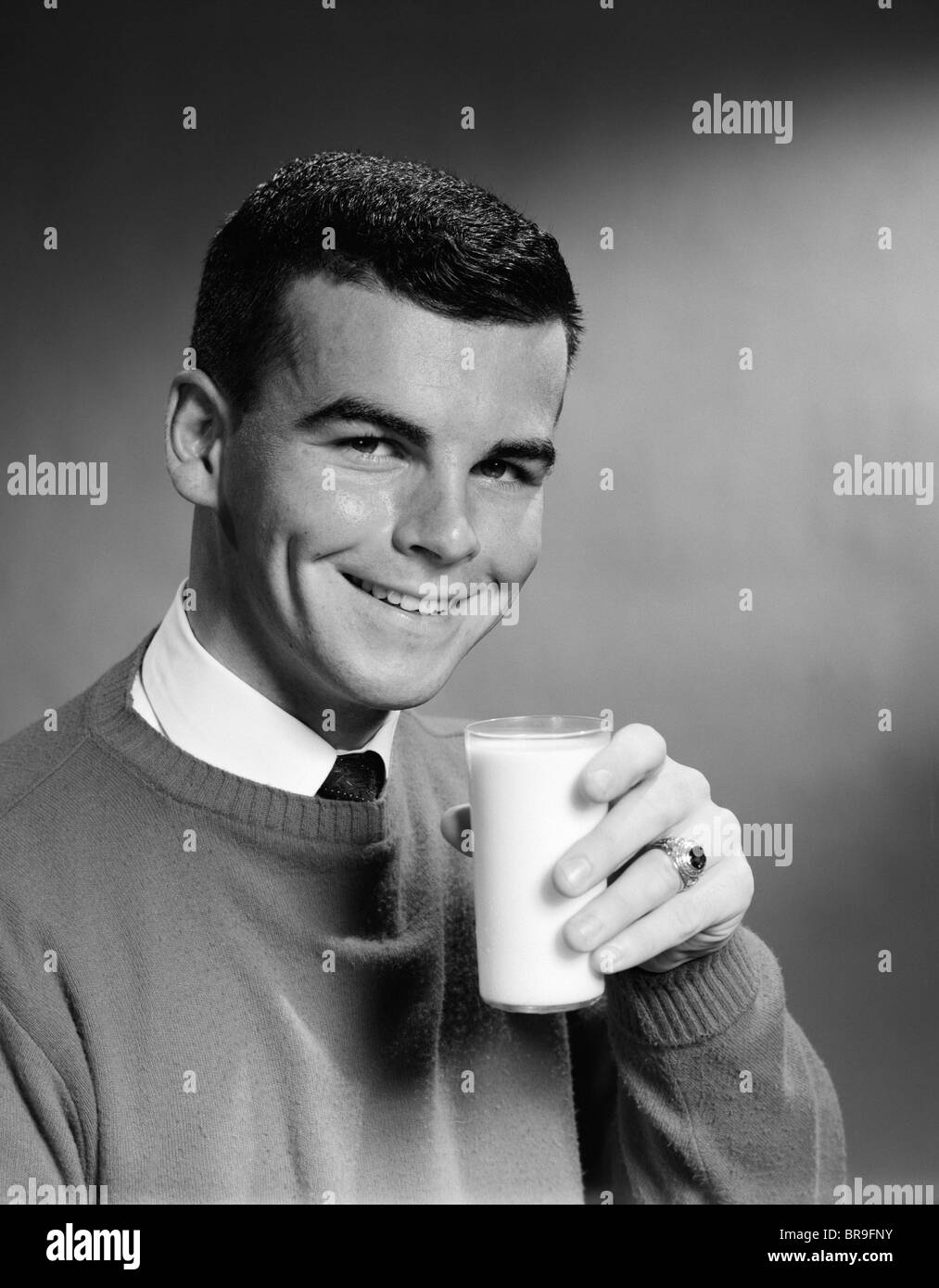 1950s YOUNG MAN SMILING HOLDING GLASS OF MILK Stock Photo Alamy
