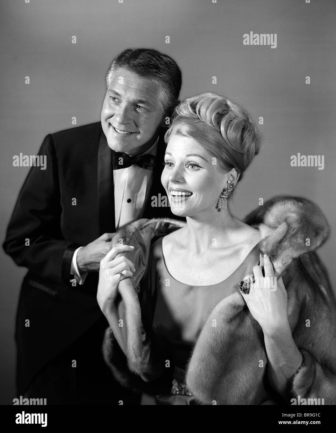 Fur coat blonde evening dress hi-res stock photography and images