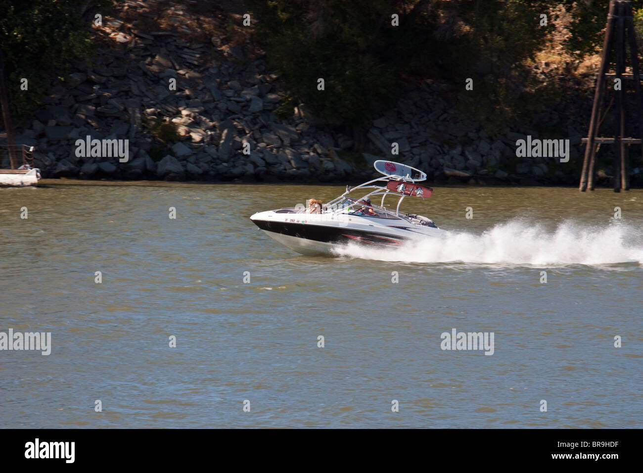Photo of a speedboat with wake boards strapped to the top Stock Photo