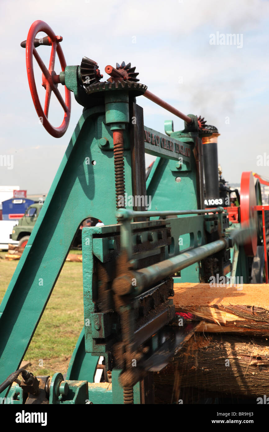 Steam engine powered, belt driven, band saw timber cutting closeup