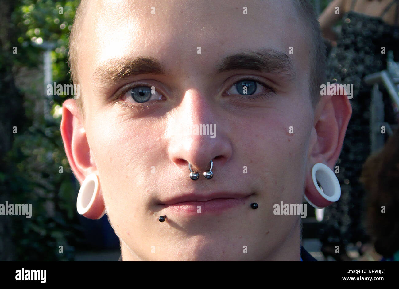 Ear piercing boy hi-res stock photography and images - Alamy