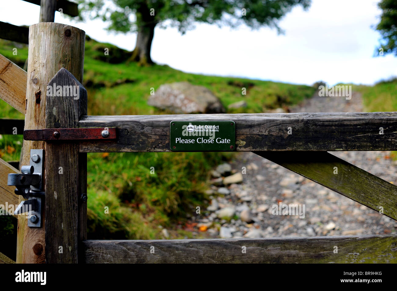 Please Close Gate Sign On A Gate At Loughrigg Fell Near The Lake please-close-gate-sign-on-a-gate-at-loughrigg-fell-near-the-lake