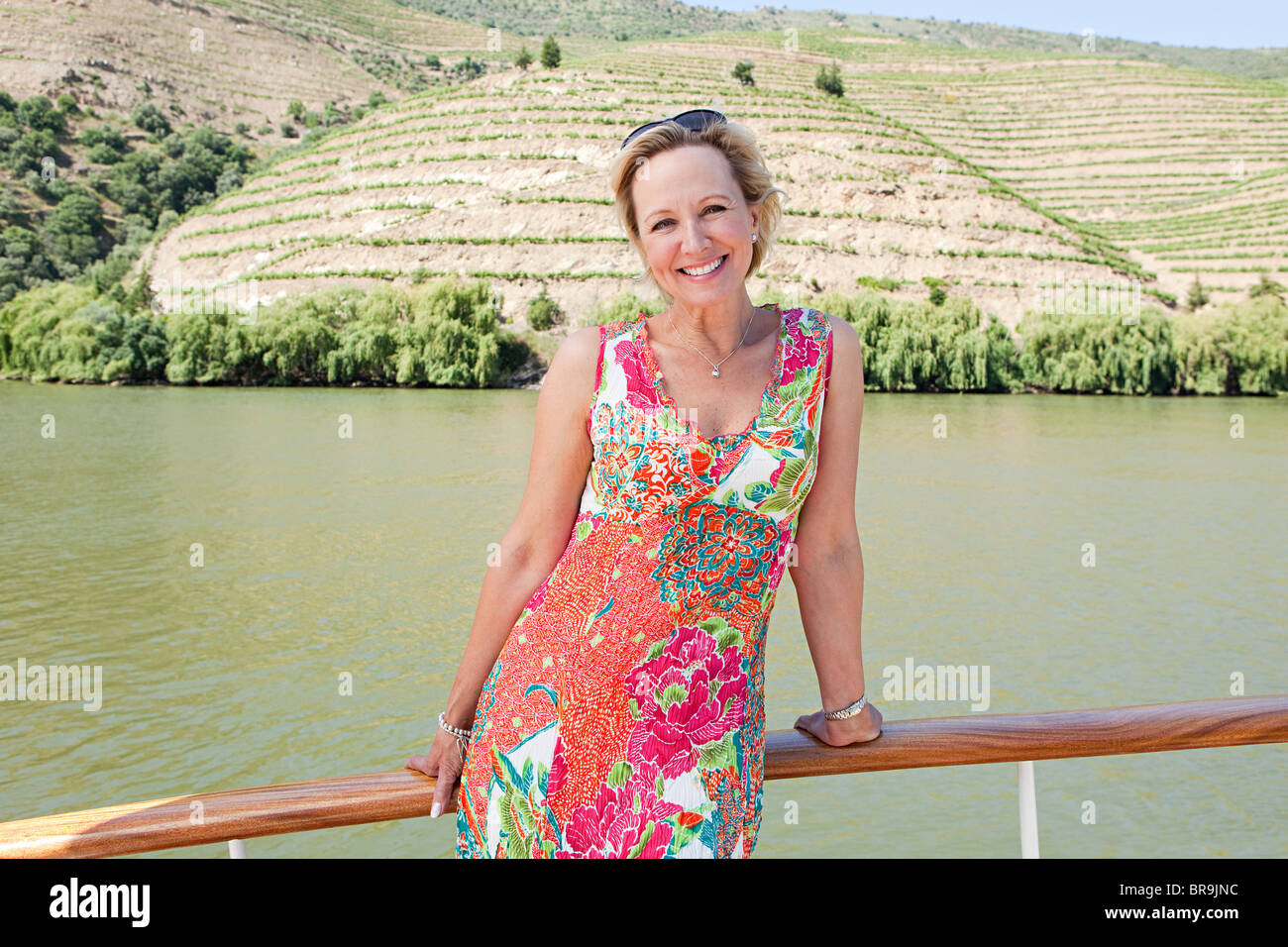 Mature woman on a boat holiday Stock Photo