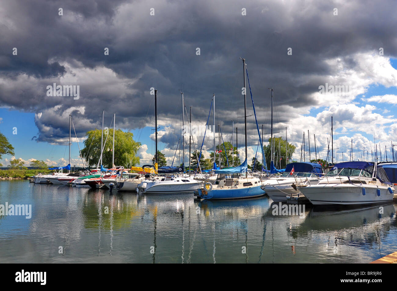 Barrie Ontario with boats in the harbour and dark clouds above Stock Photo