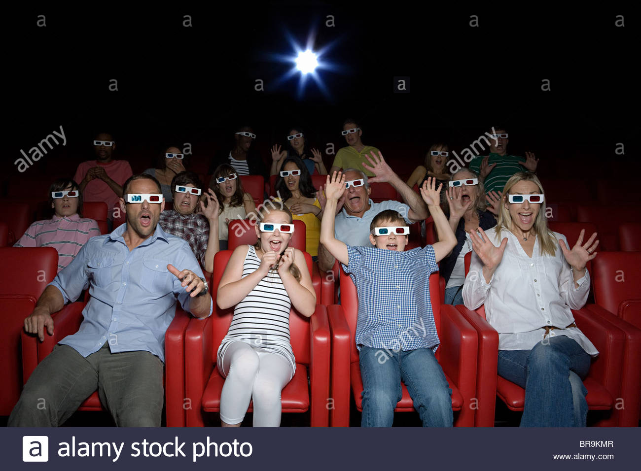 Family watching 3d movie at the movie theater Stock Photo: 31560503 - Alamy