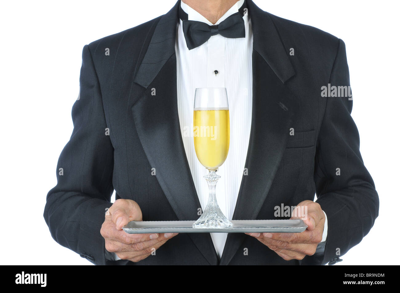 Man in Tuxedo Champagne Flute on Tray. Stock Photo