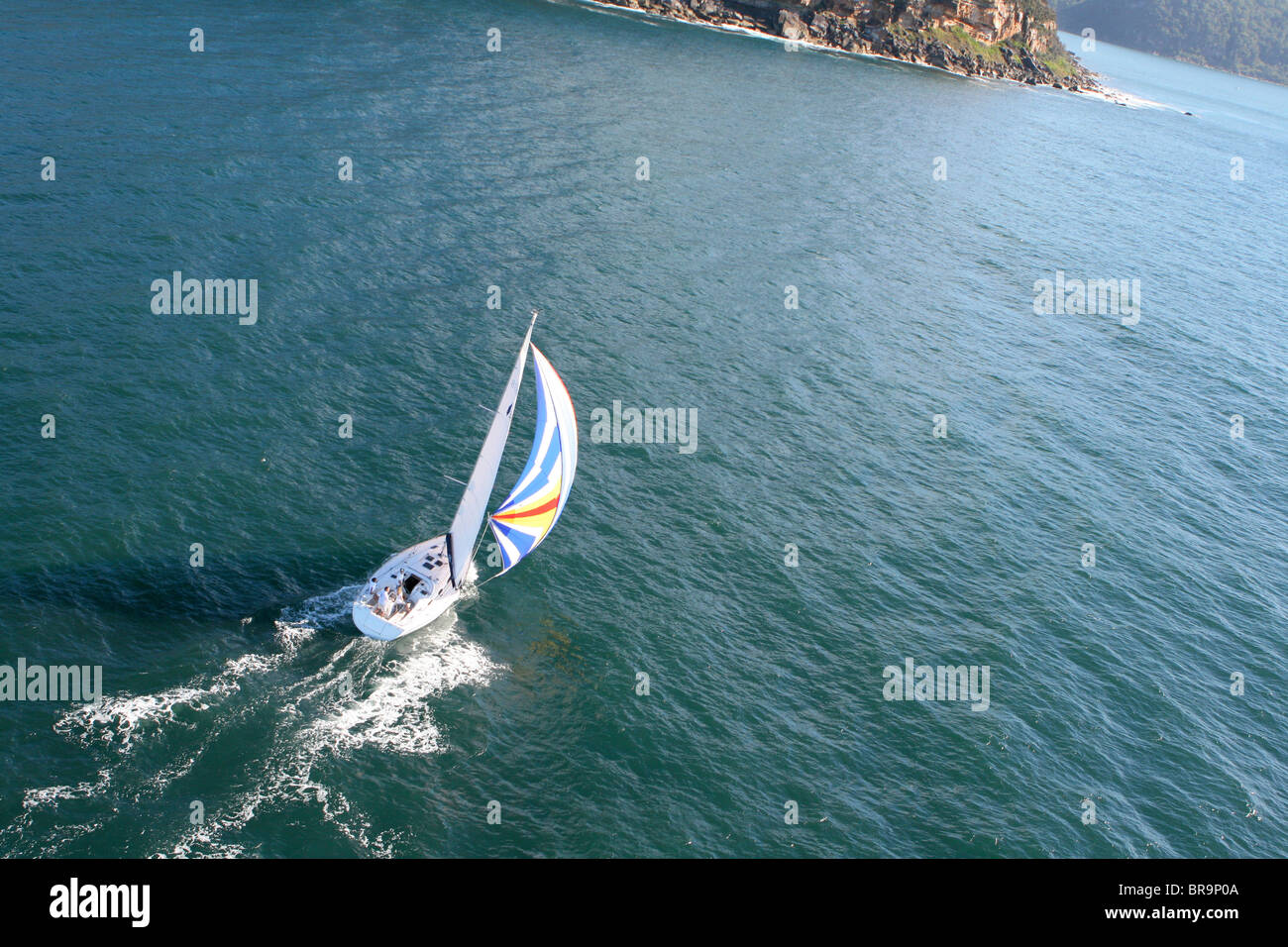Aerial view of a yacht under spinnaker. Stock Photo
