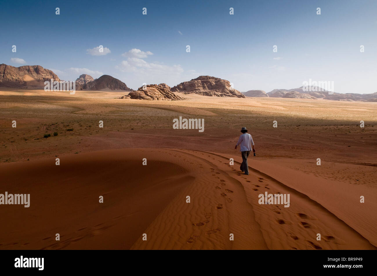 tourist taking in desert view at Wadi Rum in Jordan Stock Photo