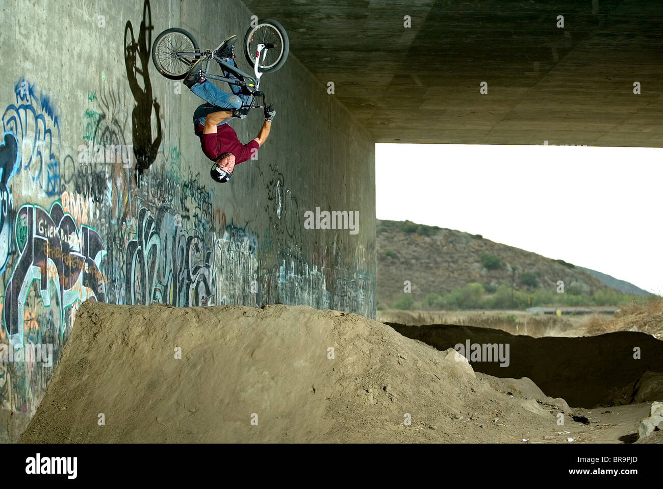 BMX rider does a barrel roll out of a wallride Stock Photo Alamy