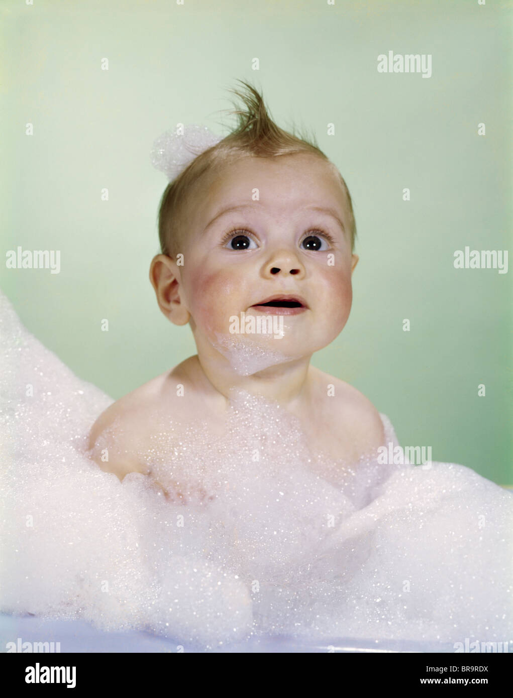 1960s BABY SITTING IN BATH SURROUNDED BY SUDS Stock Photo Alamy
