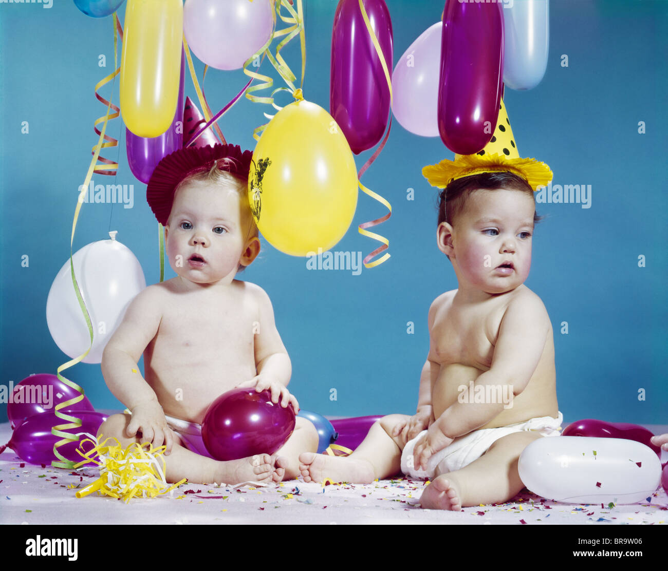 Two children wearing birthday hats hi-res stock photography and images ...