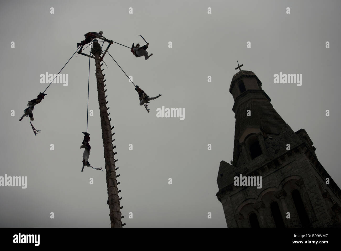 Birdmen, Voladores y Hombres Pajaro, perform during Sunday market outside San Francisco Church in Cuetzalan del Progreso Mexico Stock Photo