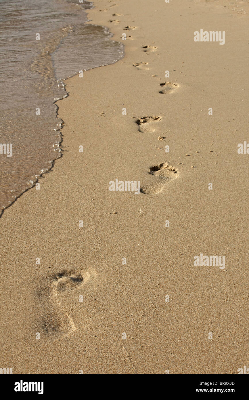 Footprints on the beach Stock Photo