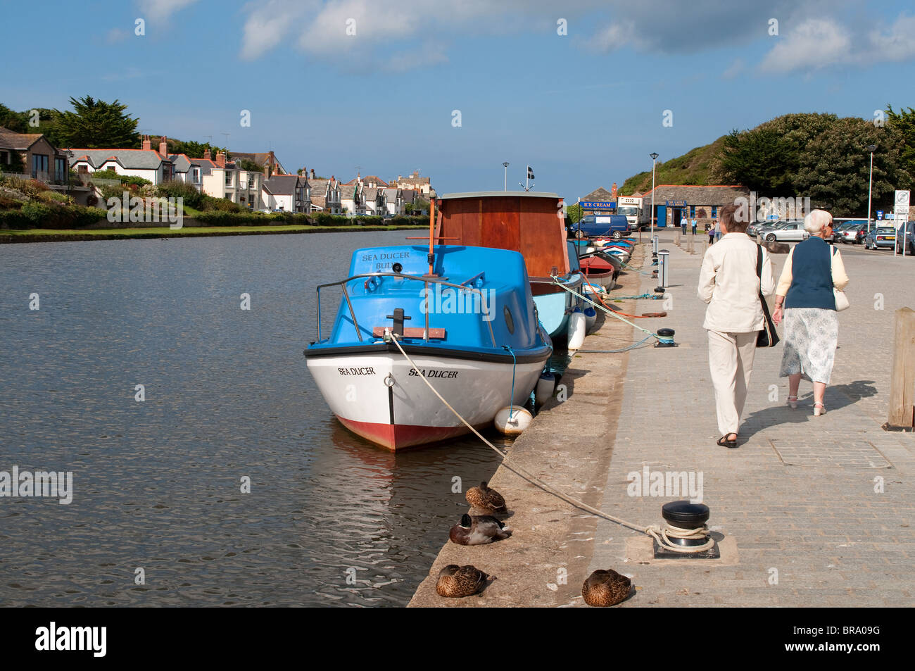 people strollling along side the canal in bude, cornwall, uk Stock Photo