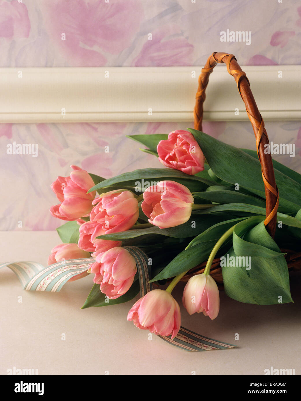 1990s STILL LIFE BASKET OF PINK TULIPS AND RIBBON Stock Photo - Alamy