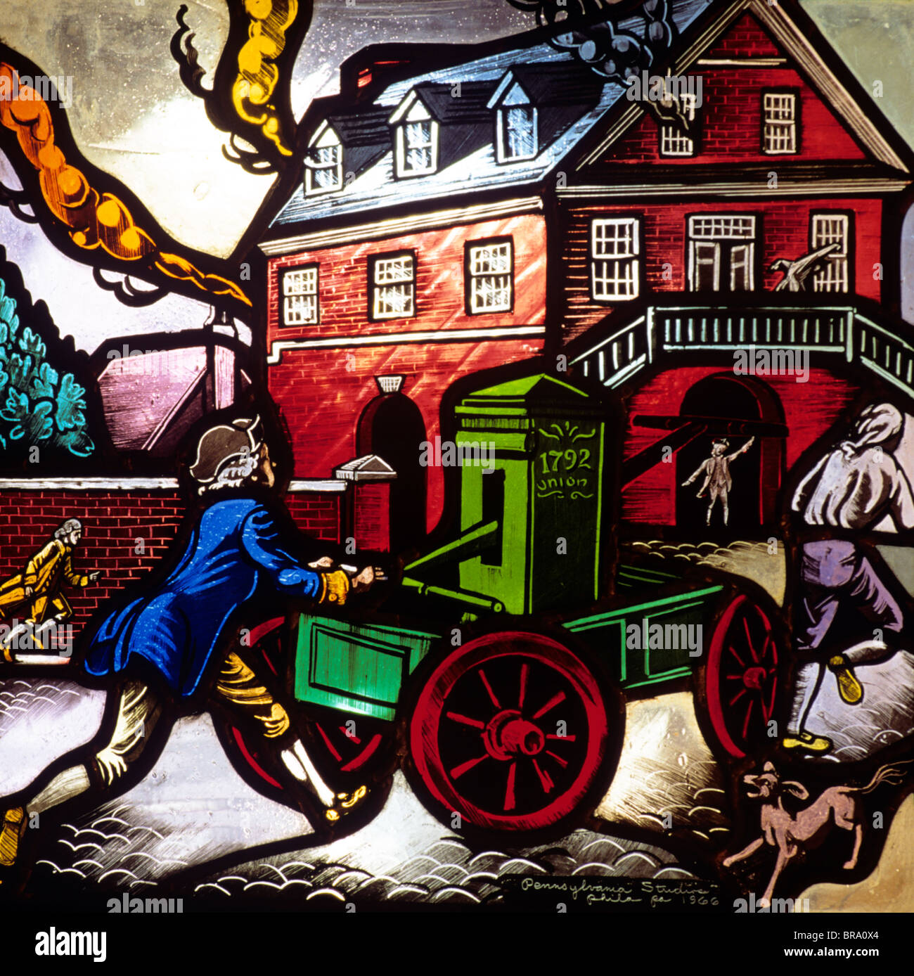 STAINED GLASS WINDOW OF FIREMEN PUTTING OUT HOUSE FIRE WITH 1792 HAND PUMPER FIRE ENGINE Stock Photo