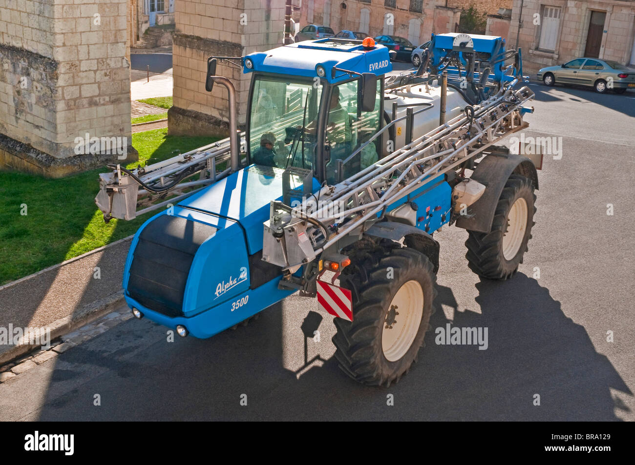 Evrard Alpha Plus 3500 agricultural crop sprayer driving through town  center - France Stock Photo - Alamy