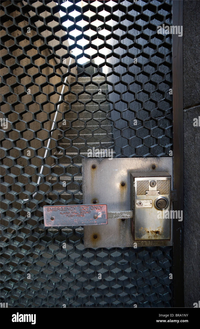 Push bar emergency exit gate at bottom of exterior stairwell Stock