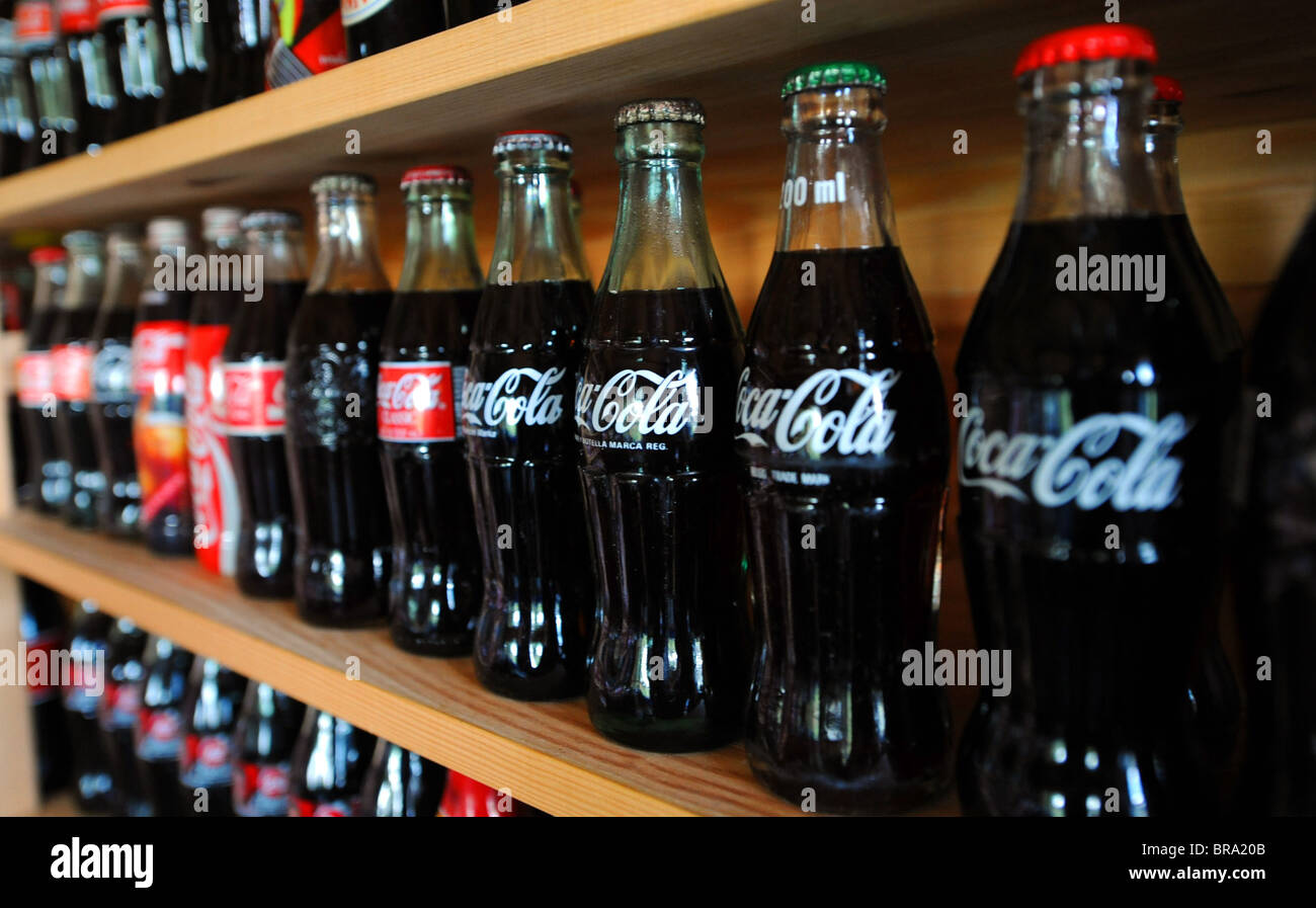 Old bottles of Coca Cola or coke Stock Photo