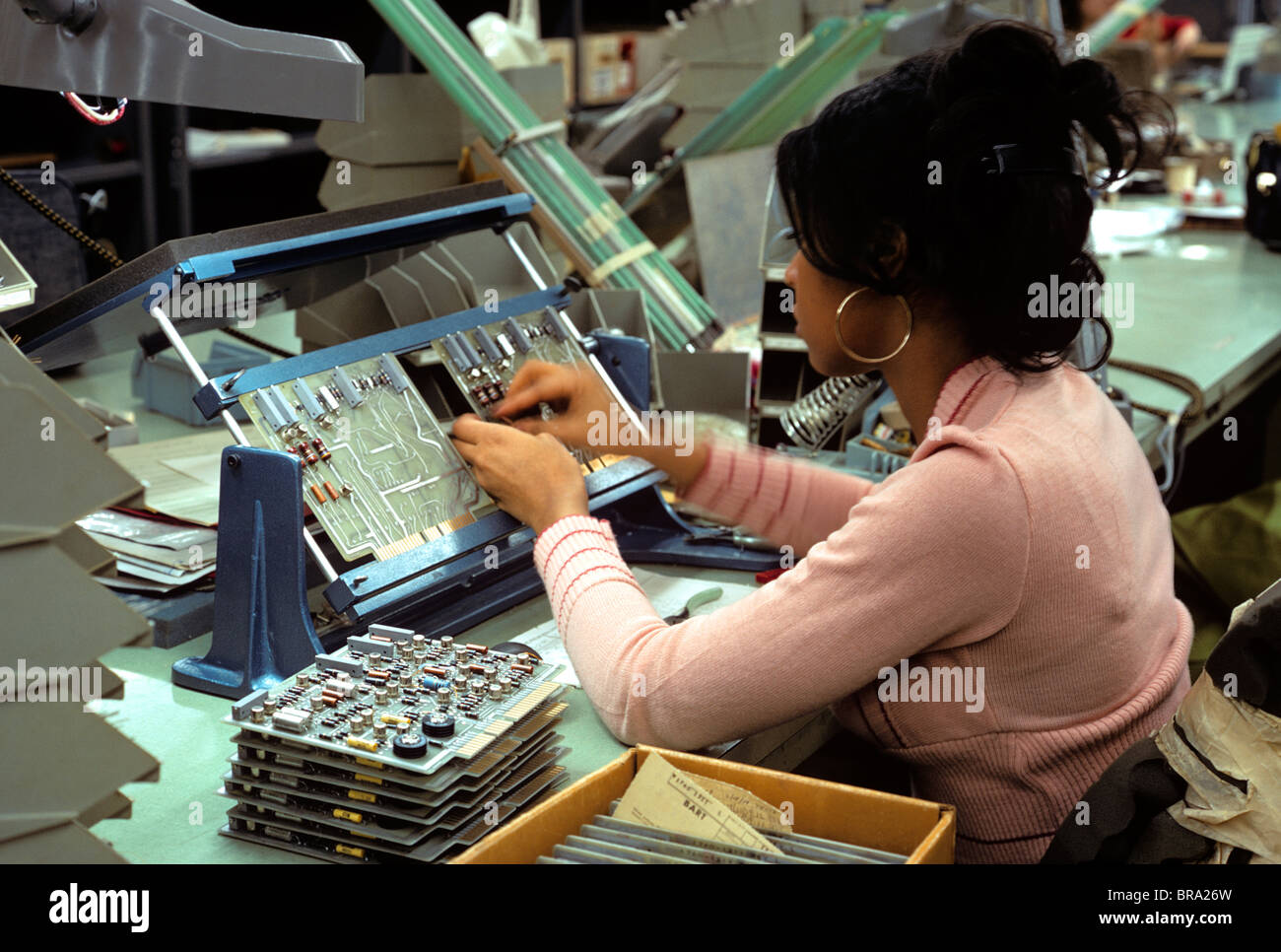 ASSEMBLING COMPUTER WOMAN WORKER Stock Photo