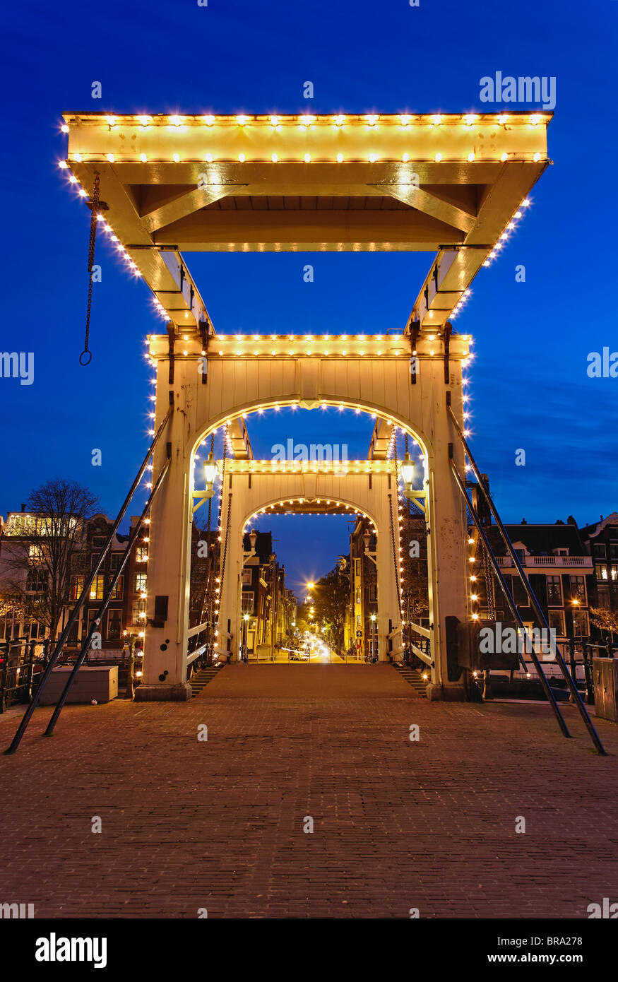 Dusk view of Magere Brug or Skinny Bridge; Netherlands, Holland Stock Photo