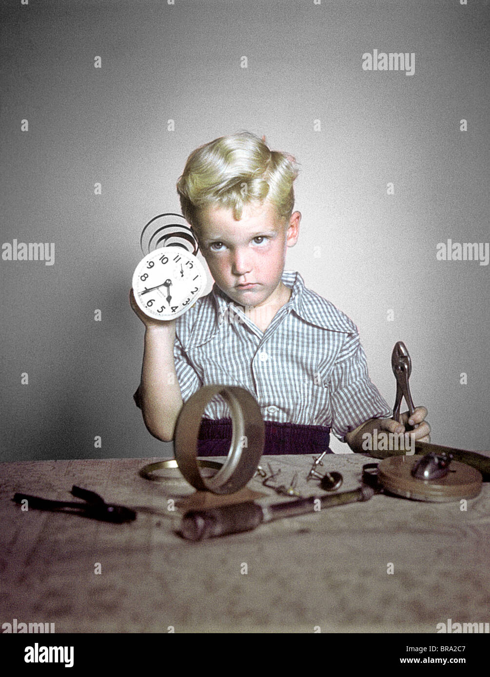 1940s 1950s FUNNY BOY CONFUSED TAKING APART CLOCK TOOLS Stock Photo Alamy