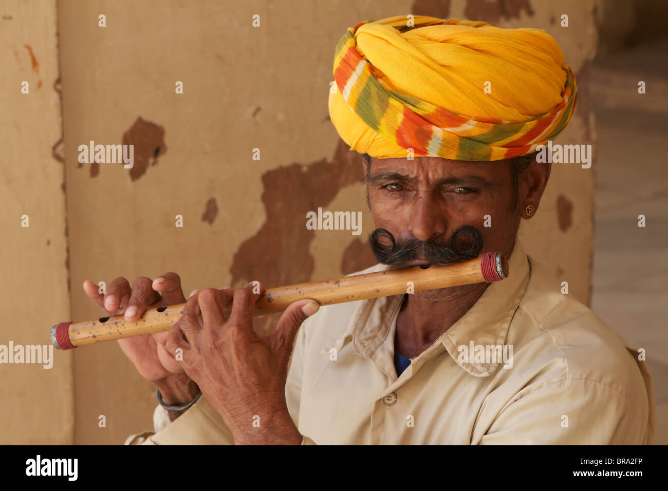 Indian man playing flute hires stock photography and images Alamy