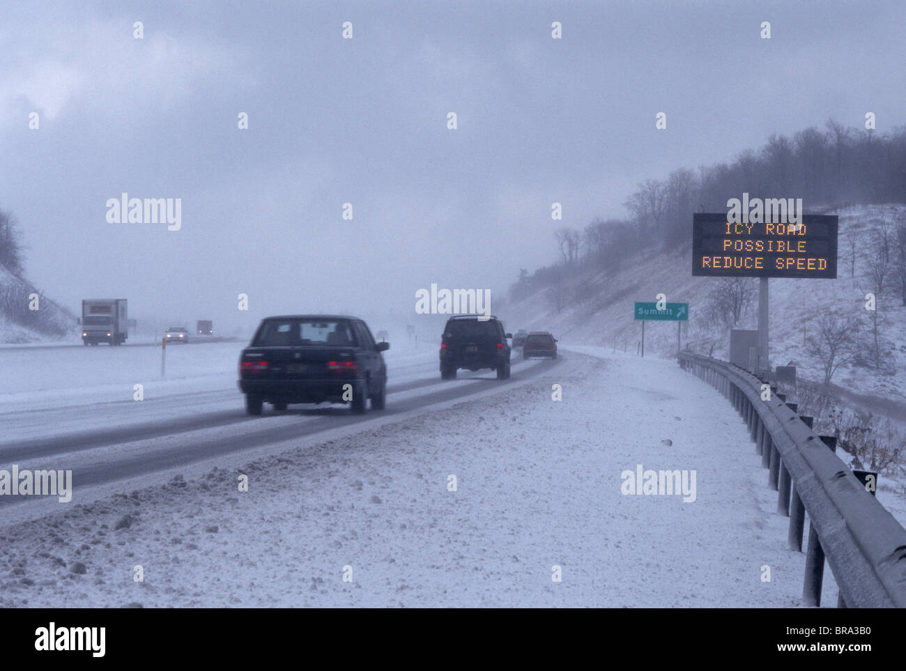 ROAD CONDITION WARNING SIGN ON HIGHWAY WINTER Stock Photo - Alamy