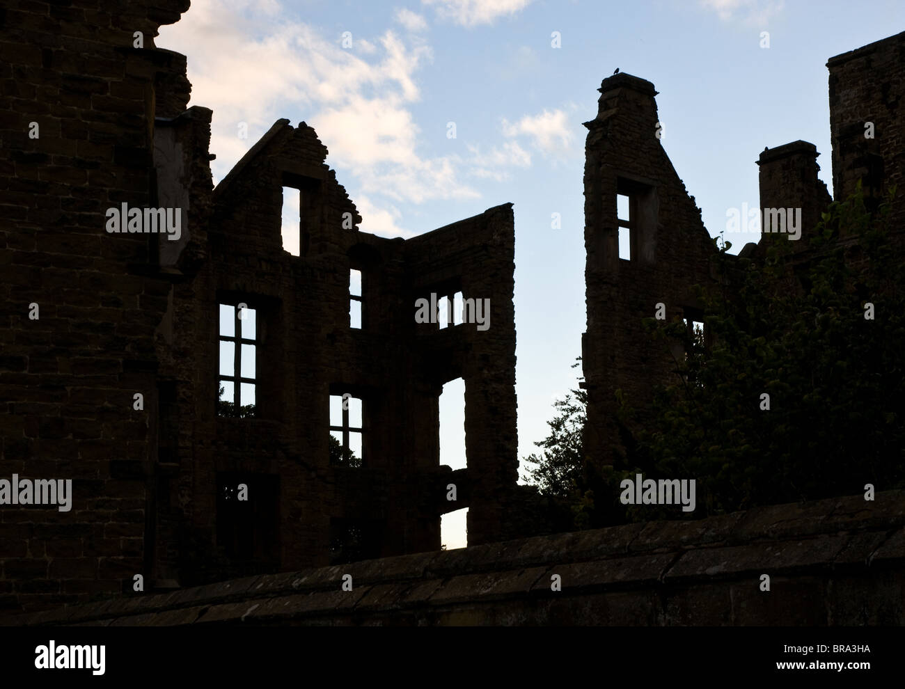 Silhouetted ruins of Hardwick Old Hall Derbyshire Stock Photo