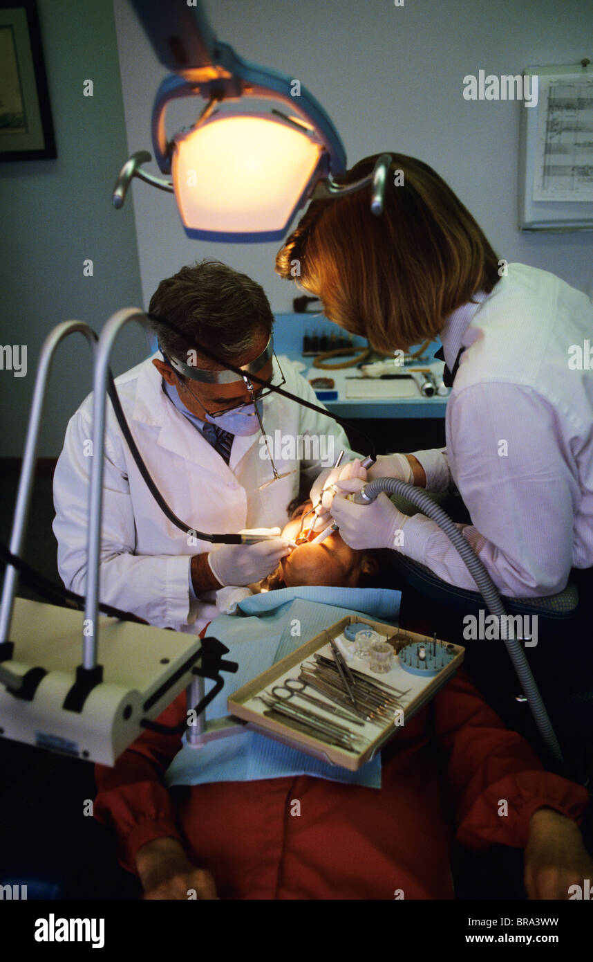 1980 1980s RETRO DENTIST ASSISTANT PATIENT SURGERY Stock Photo Alamy
