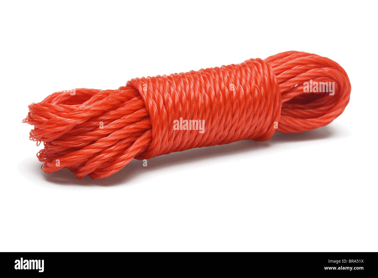 Bundle of red nylon rope on white background Stock Photo