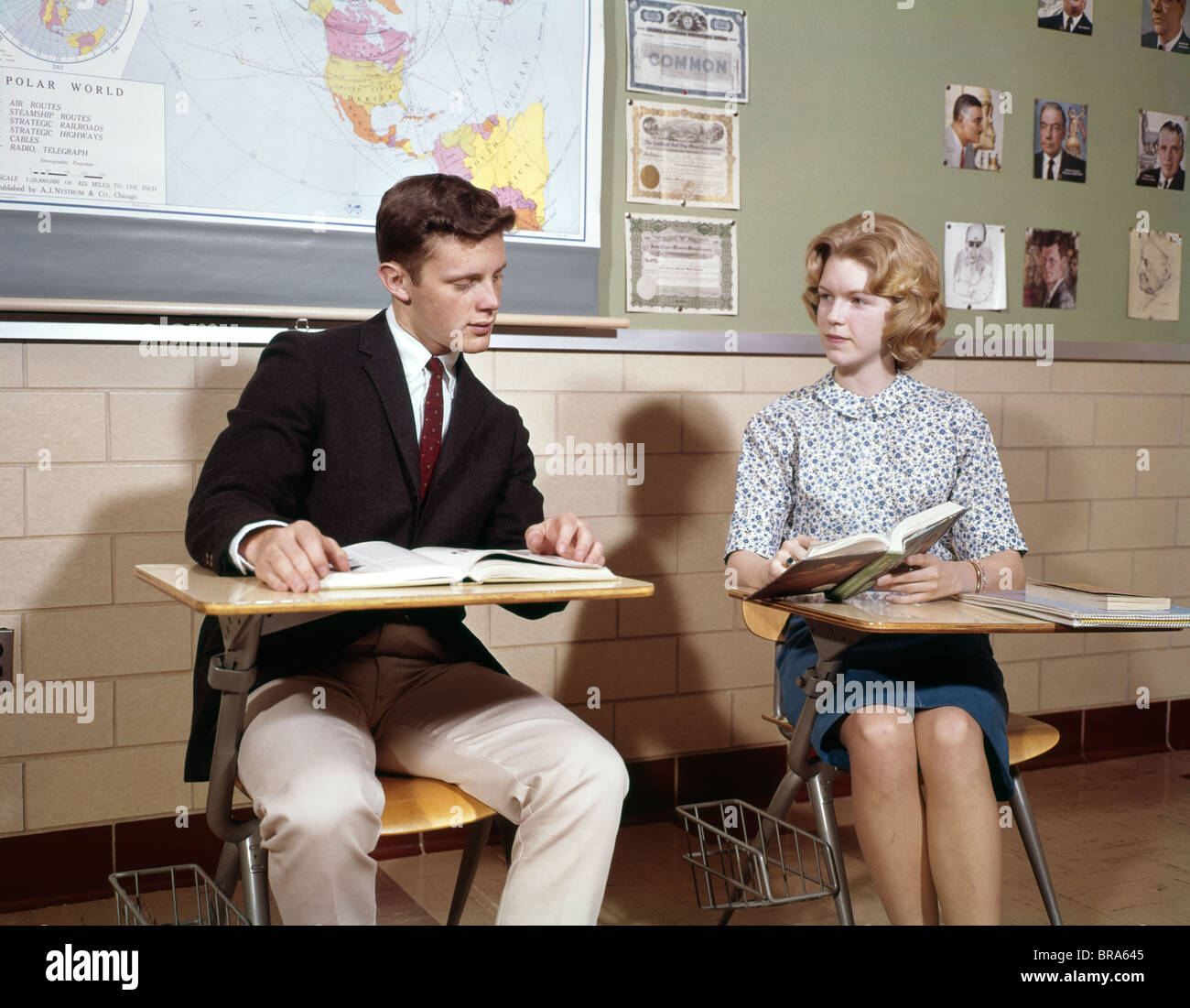 1960s Teenage Boy Girl Seated Classroom Desks Talking Studying