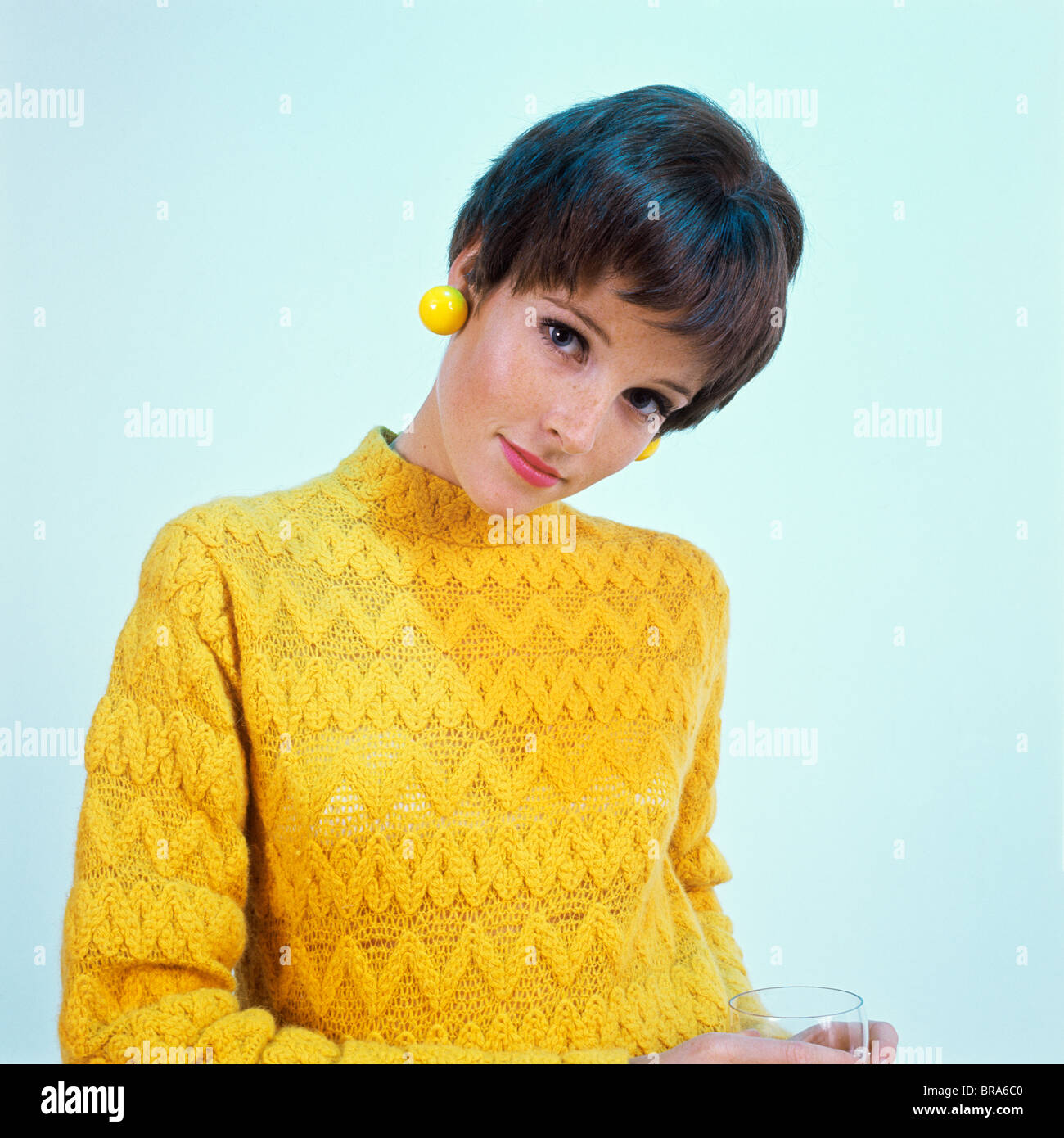 1960s Brunette Woman Short Pixie Hair Style Yellow Knit Sweater