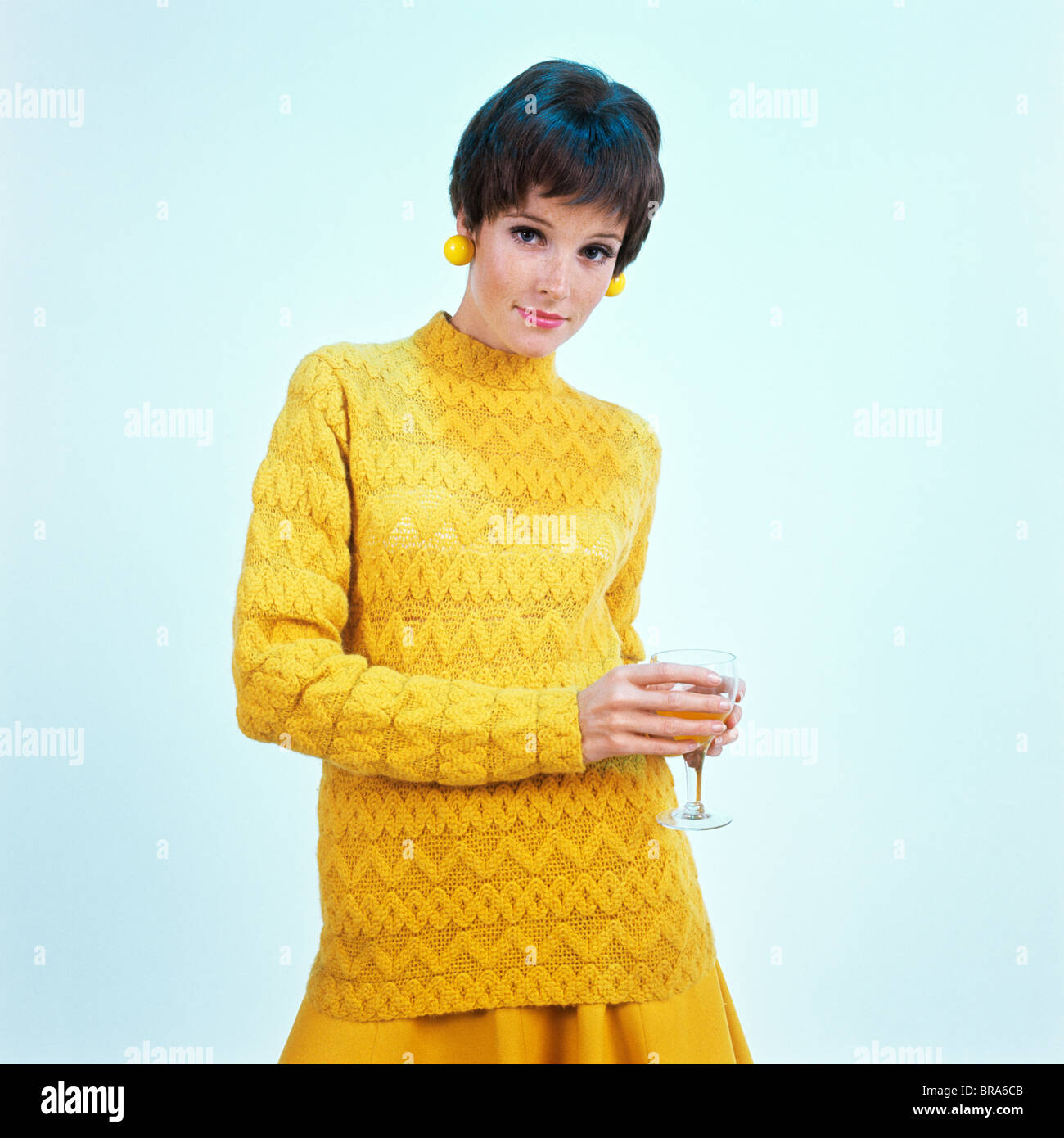 1960s Brunette Woman Short Pixie Hair Style Yellow Knit Sweater