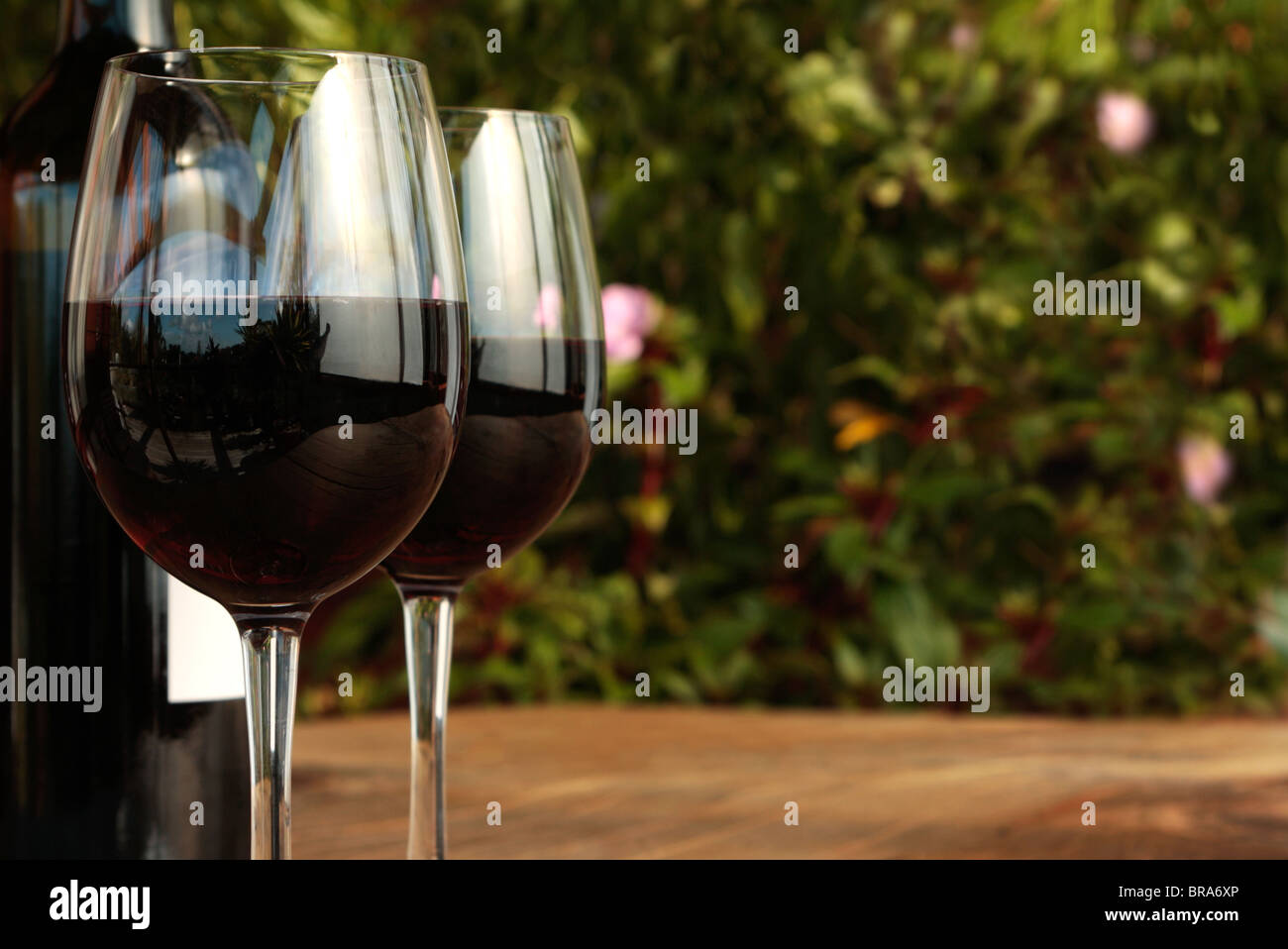 Bottle & Glasses of Red Wine on Table 3 Stock Photo