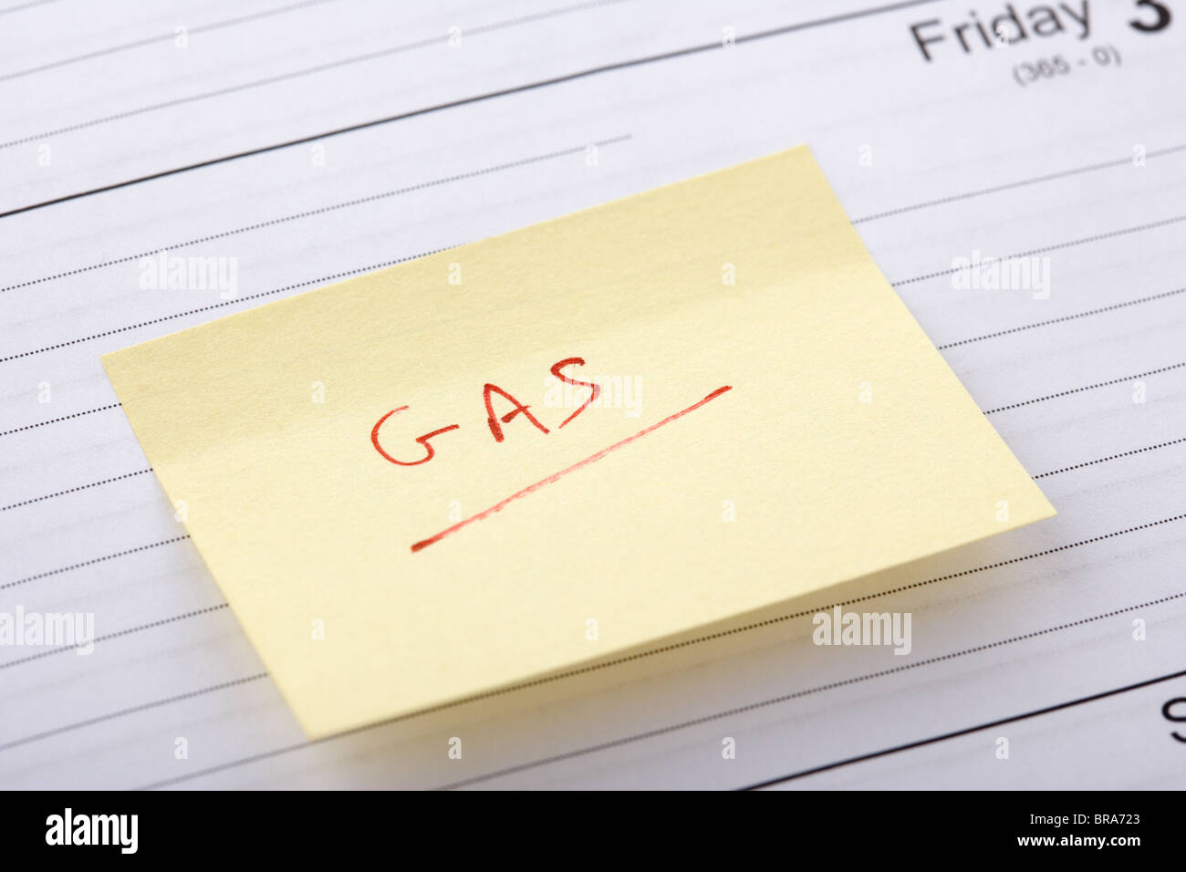 Writing Out Gas post-it note regarding gas bill stuck into a diary at the end of the ...