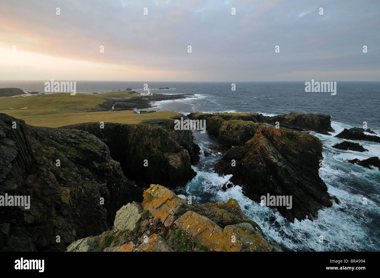 The view from Malcolm's Head towards Fair Isle South Lighthouse (the last manned lighthouse in Scotland) Stock Photo
