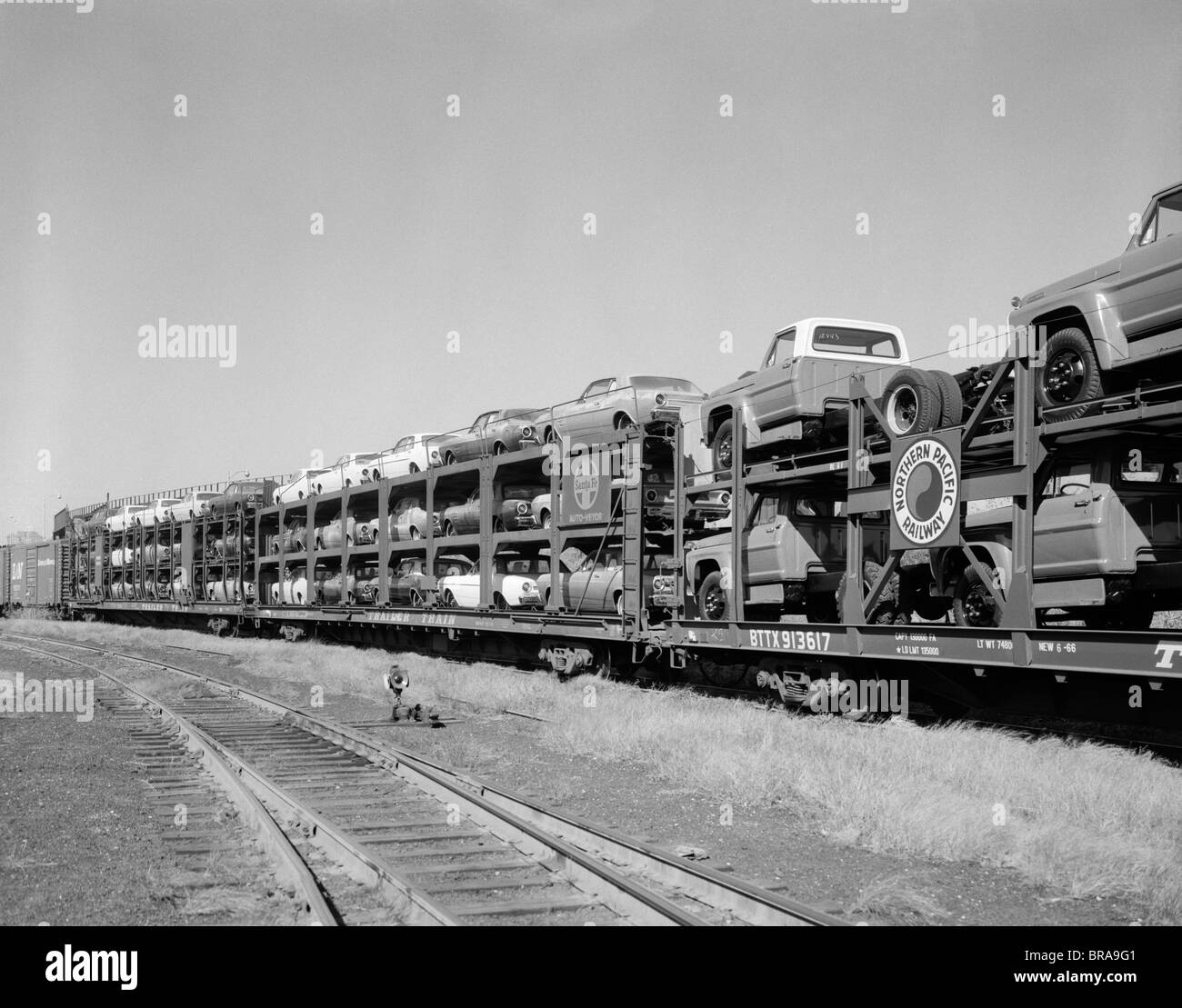 1960s FREIGHT TRAIN CARRYING CARS & PICKUP TRUCKS Stock Photo Alamy