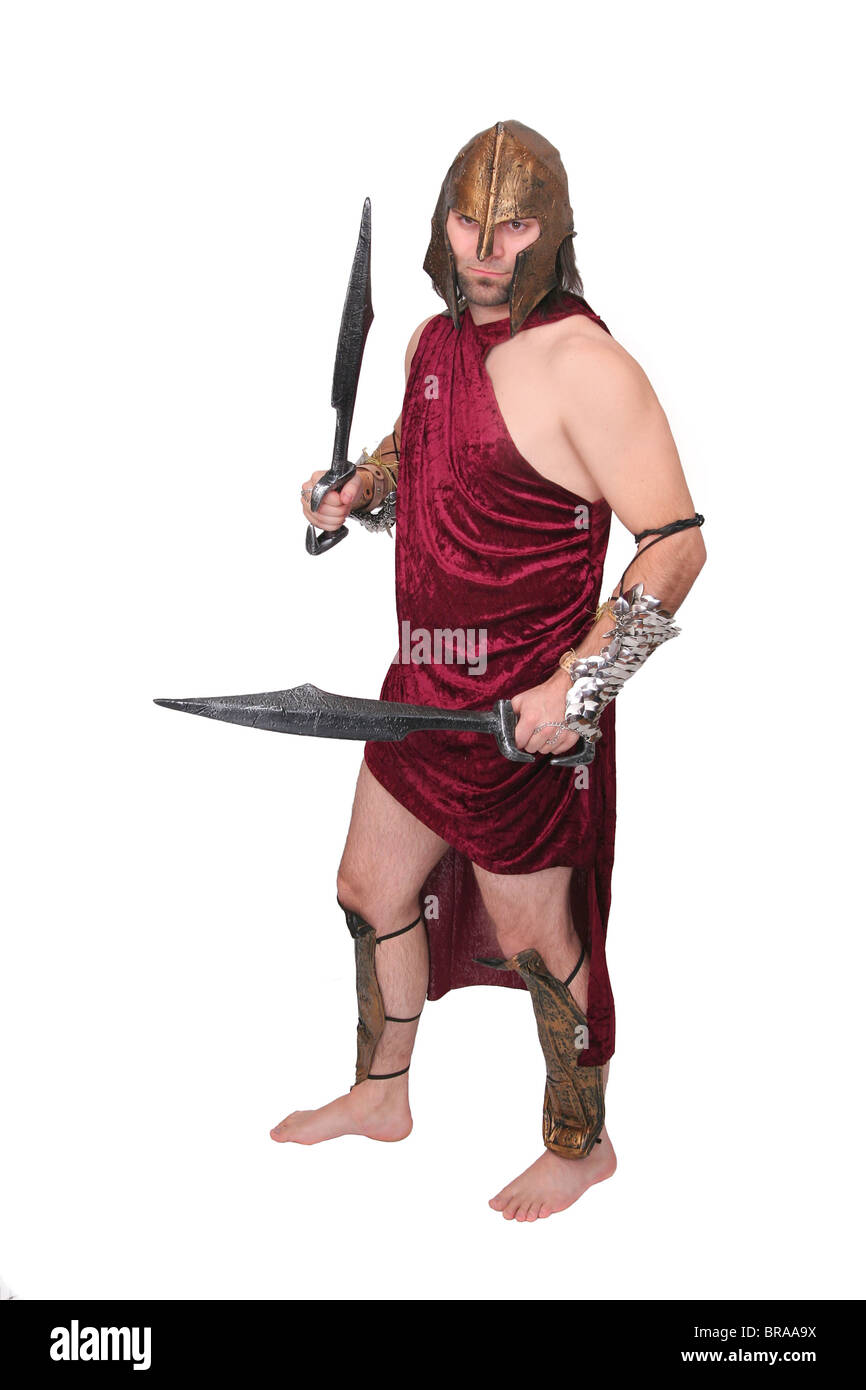 one adult male greek warrior with swords over white Stock Photo