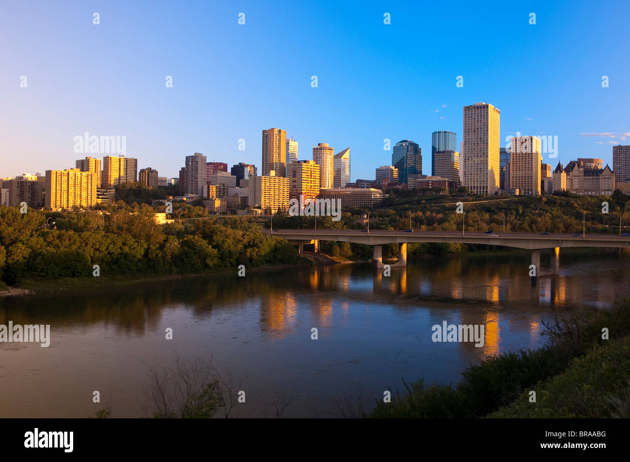 City at sunrise with the Saskatchewan River in foreground, Edmonton, Alberta, Canada, North America Stock Photo