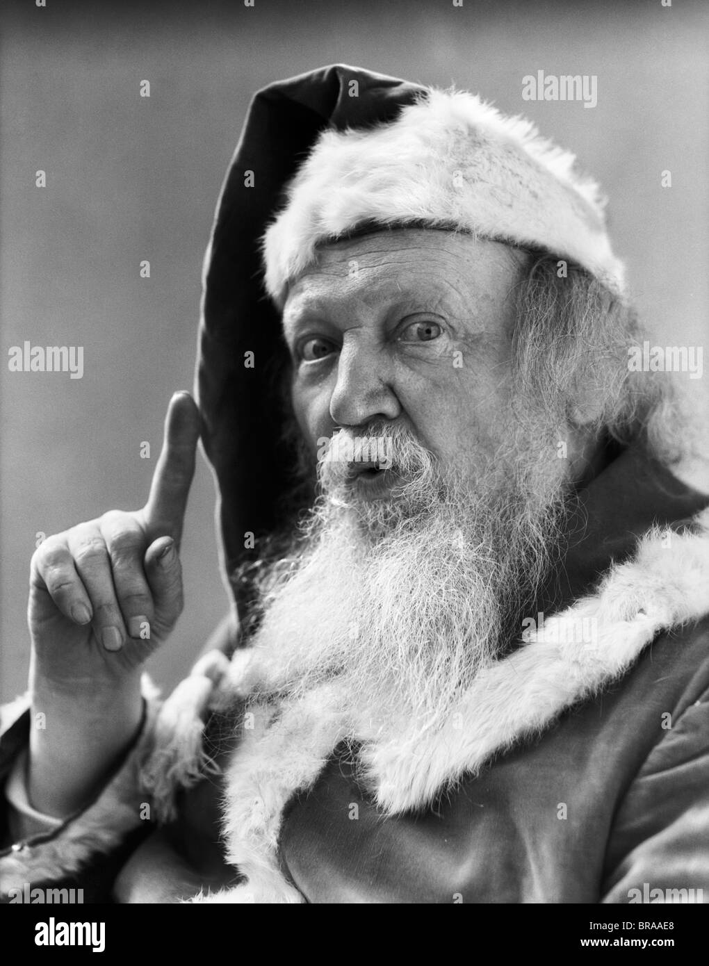 Santa claus gesture pointing finger Black and White Stock Photos ...