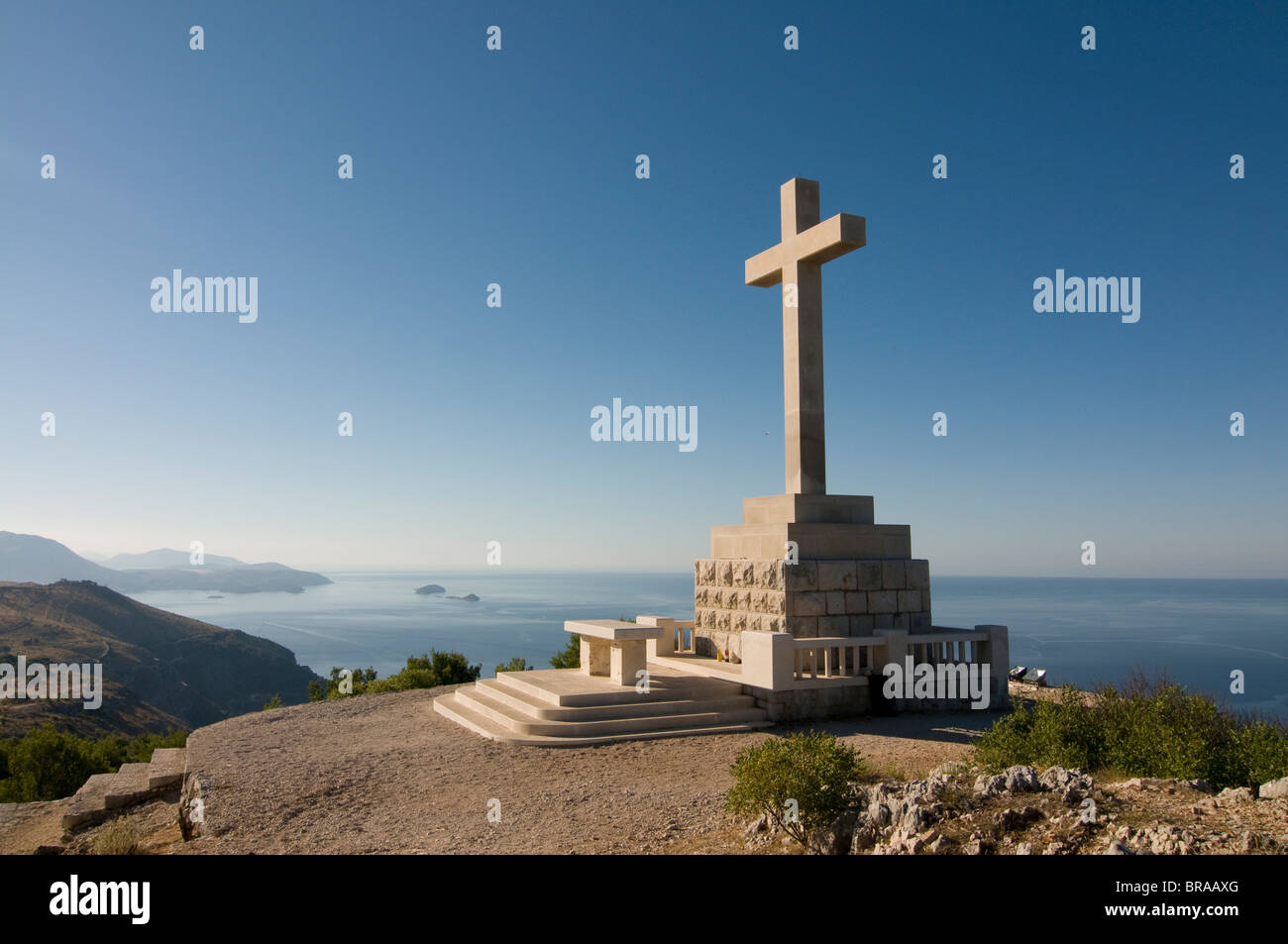 Huge Christian cross on top of the mountain above the old town of Dubrovnik, Croatia, Europe Stock Photo