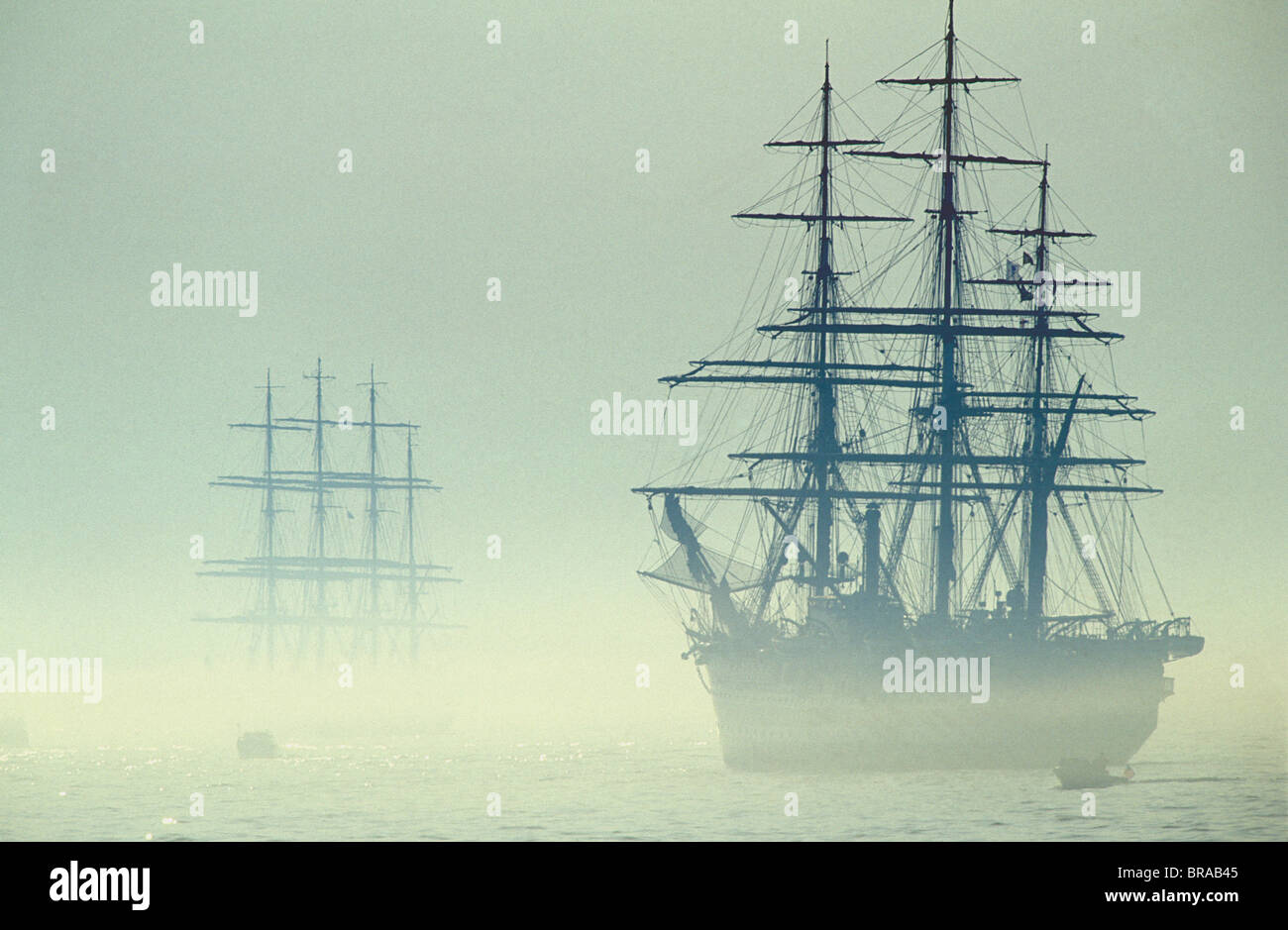 Two Tall ships in fog during Boston tall ships parade, Massachusetts, USA. 'Amerigo Vespucci' is in the foregound. Stock Photo