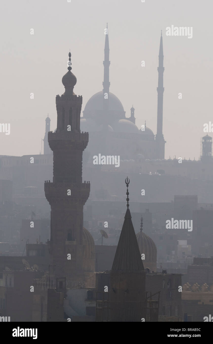 The minarets of the mosques of the old city in the smog, Cairo, Egypt, North Africa, Africa Stock Photo