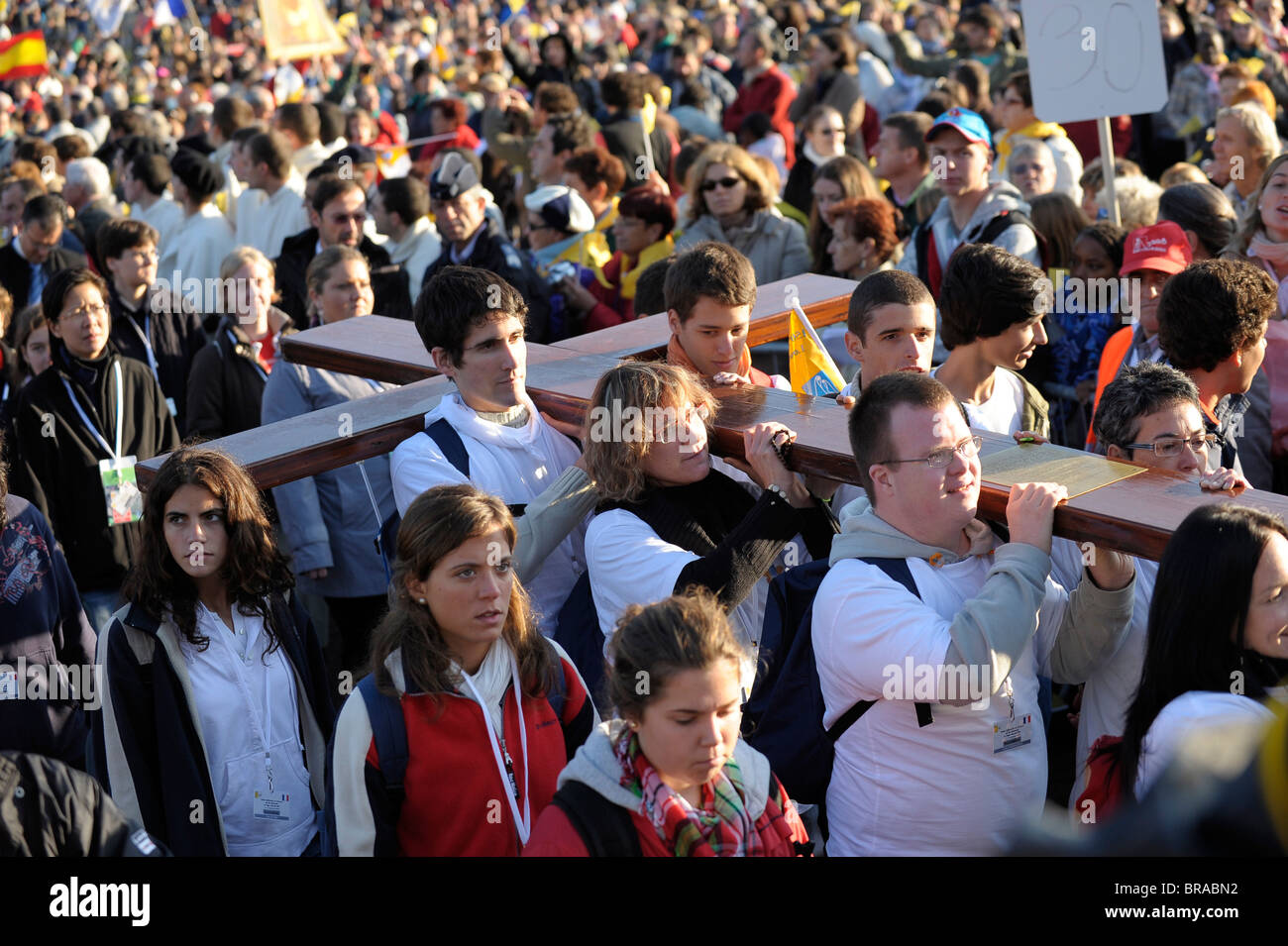 Youth carrying World Youth Days cross during the Pope's visit to Lourdes, Hautes Pyrenees, France, Europe Stock Photo