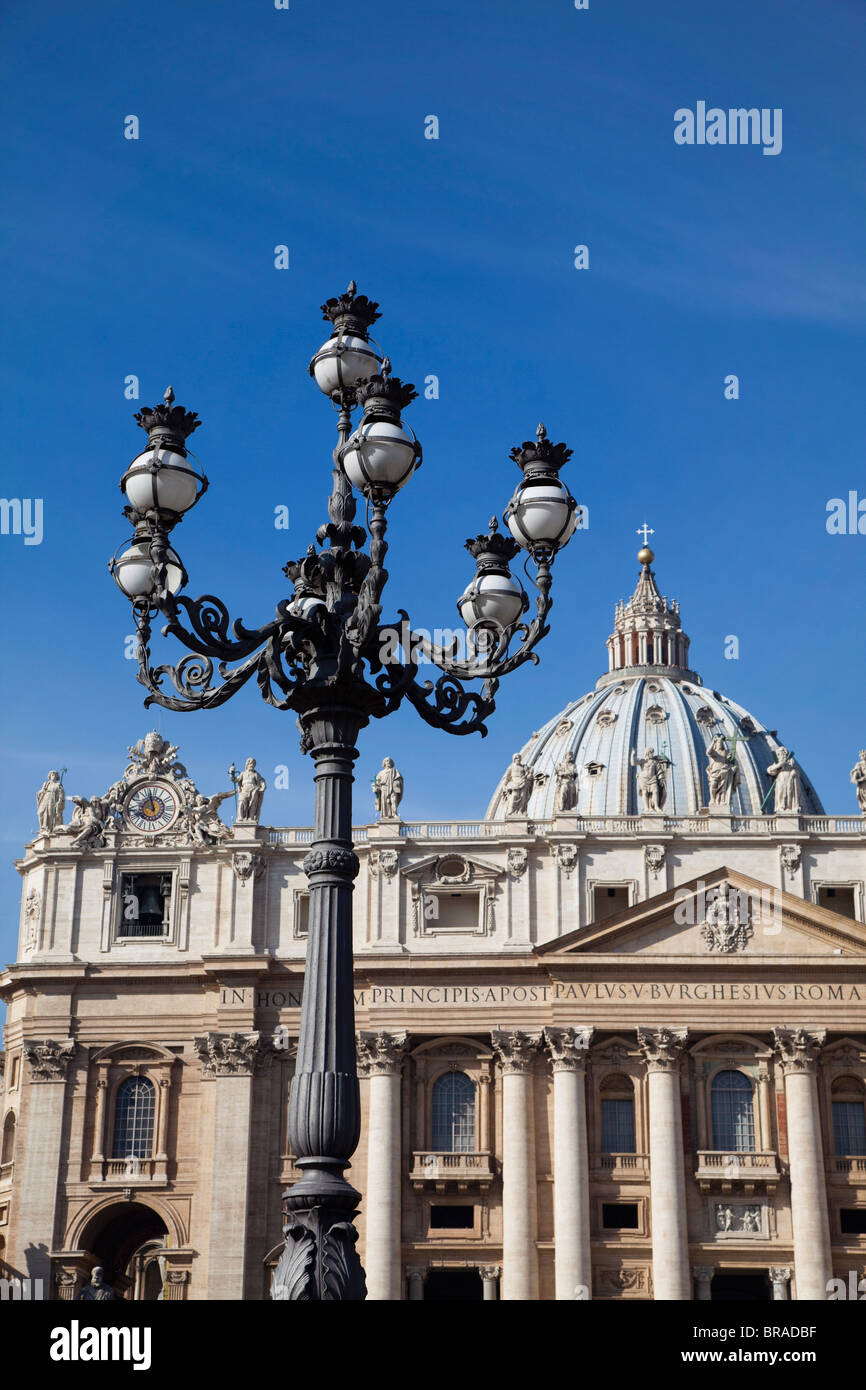Ornate lamp and St. Peter's Basilica, Piazza San Pietro, Vatican City, Rome, Lazio, Italy, Europe Stock Photo