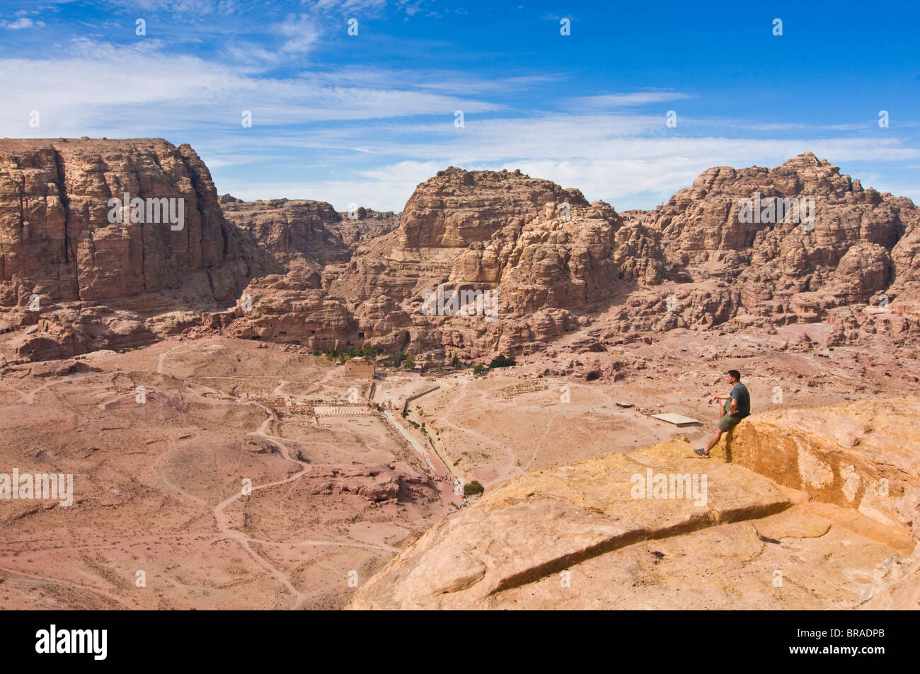 Traveller enjoying the view over Petra, UNESCO World Heritage Site, Jordan, Middle East Stock Photo