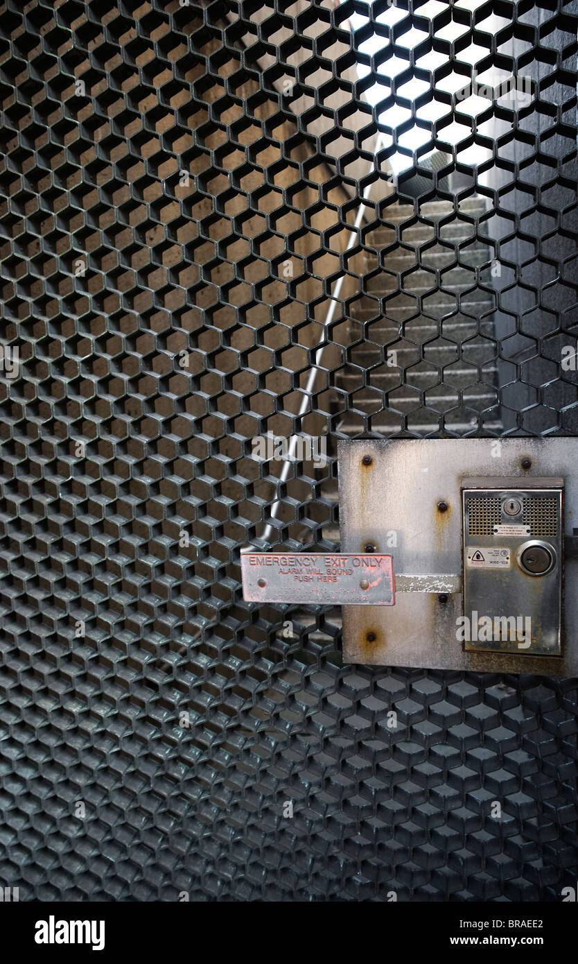 Push bar emergency exit gate at bottom of exterior stairwell Stock