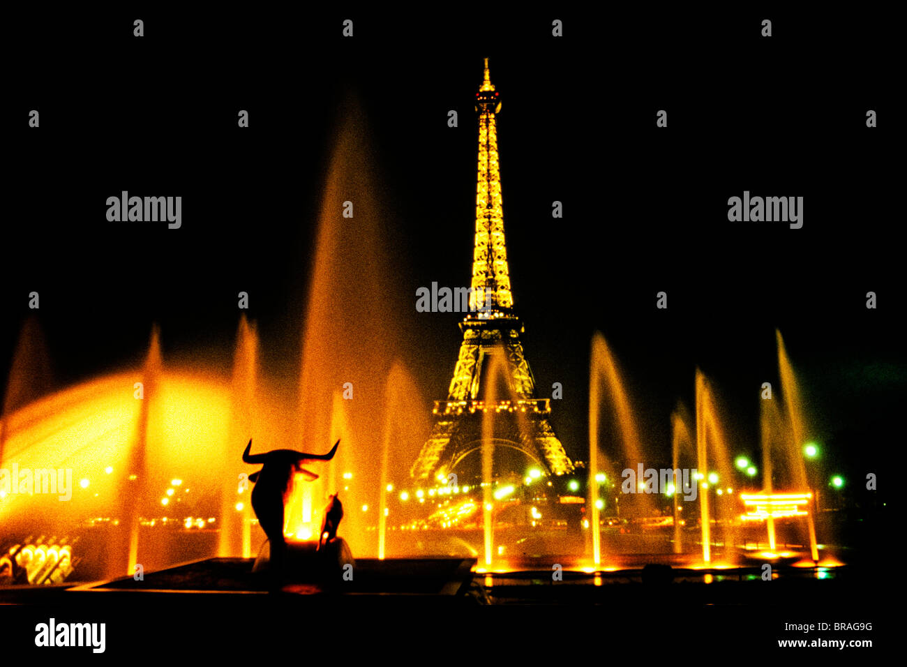 the famous Eiffel Tower through fountains in Paris France at night Stock Photo Alamy