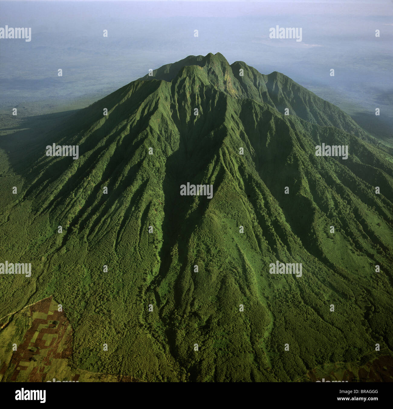 Aerial view of Mount Sabyinyo, an extinct volcano and oldest of the Virunga Mountains, the summit at 3645ï Stock Photo